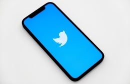 phone with blue Twitter loading page on it; Photo by Jeremy Zero on Unsplash