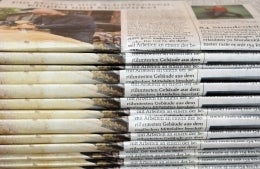 stack of newspapers; Photo by Waldemar Brandt on Unsplash