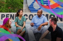 four people sitting and talking