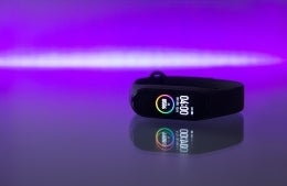 Fitness tracker against purple background