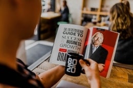 Image of person holding magazine with Richard Branson featured