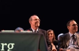 David Eisenhower seated in an audience, smiling and looking off to the side
