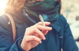 Woman holding a cigarette