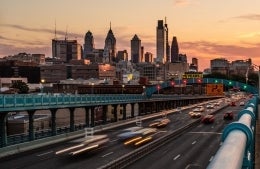 Philadelphia skyline in the evening with highway in the foreground