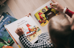 Person reading a book to a child