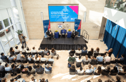 Former Australian Prime Minister Malcolm Turnbull, Kathleen Hall Jamieson and Penn climate scientist Michael E. Mann sit on a stage at Perry World house in front of an audience of listeners