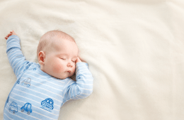 infant sleeping on its back