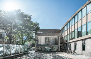 Annenberg School Walnut Street entrance with beautiful blue sky and bright sun