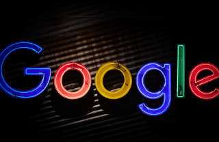 neon letters spelling out Google in multiple colors, photo credit Mitchell Luo / Unsplash