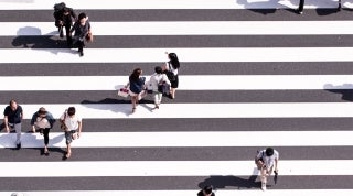 AHA_FW_Study credit Ryoji Iwata on Unsplash 1920x1070.jpg Aerial view of people walking in a crosswalk, photo credit Ryoji Iwata / Unsplash