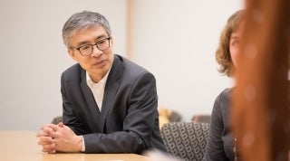CDCS_DR_Guobin_FW_1920x1070.jpg CDCS director listening during a discussion