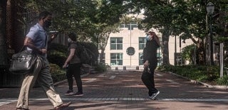 Masked walkers on Locust Walk with the Annenberg Building in the background