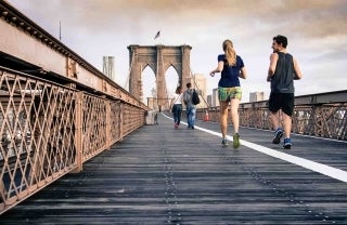 Photo of people running along the Brooklyn Bridge, photo credit Curtis MacNewton / Unsplash