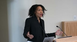 Jasmine Cobb 2 1920 x 1070.jpg Woman speaking at a podium