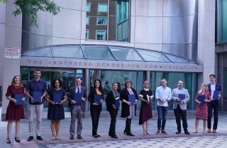 Participants of the Professional Development Day posing for the photo in front of The Annenberg School for Communication 