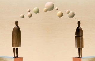 Cover of PARGC Paper 4. Two wooden human-like figures stand to the left and right of the image on orange cubes with white tops. From head-to-head in an arc shape are circles of very faded green, red and yellow.