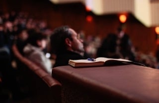 People sitting in audience at conference, photo credit John-Mark Smith / Unsplash