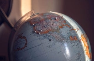Close-up shot of a globe. photo credit Nicole Geri / Unsplash