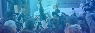 crowd of people protesting, photo credit iStock / Alexander Gouletas