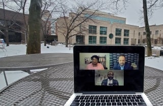 laptop on table with Annenberg School in background