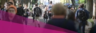 sidewalk filled with people walking 