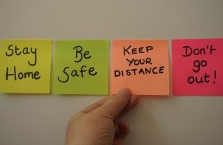 post it notes that say Stay Home, Be Safe, Keep Your Distance, and Don't Go Out!; Photo by Sarah Kilian on Unsplash