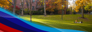 Two people sitting on the grass on the Penn campus
