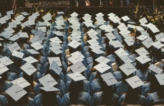 rows of graduates from above; Photo by Joshua Hoehne on Unsplash
