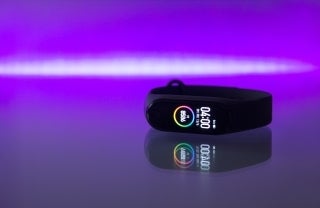 Fitness tracker against purple background