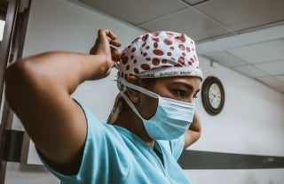 Healthcare worker securing mask