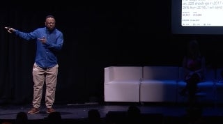 FW_Video.jpg Demond Patton speaking on a stage