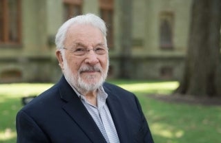 Portrait of Klaus Krippendorff in front of College Hall