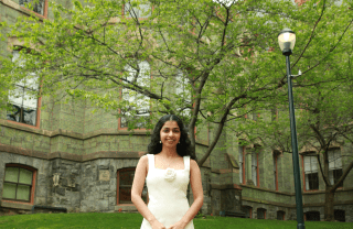 Anika Gururaj stands in front of College Hall on the UPenn campus=