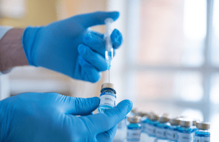 misinformation in social media example essay A person with gloved hands puts a needle into a vaccination vial