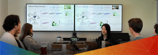 Photo of lab member presenting research at their dissertation defense