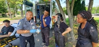 Medic teaching students how to use Narcan