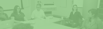 CDCS_RecentPublications_1920x550.png Image with green overlay of CDCS director and various members having a discussion around a conference table