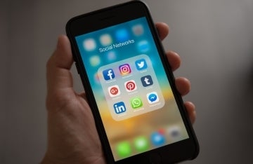 phone screen showing social media icons; Photo by Tracy Le Blanc on Pexels