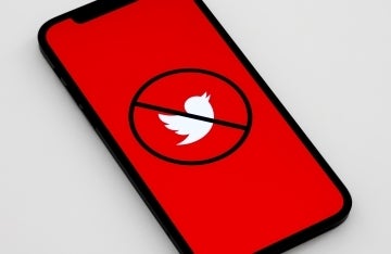 image of a phone with a stop sign over Twitter logo