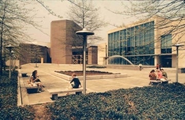 Faded color photo of Annenberg Plaza and Annenberg Center and School buildings in the 1970s