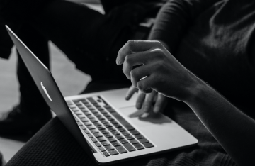 Person typing on laptop