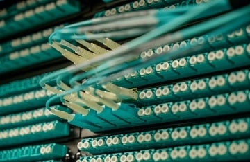 Turquoise wires plugged into a power source