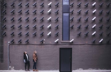 Women look at security cameras