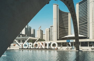 Outdoor area with a sculpture of the word "Toronto".