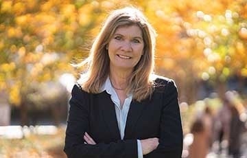 Sarah Banet-Weiser in a suit smiling