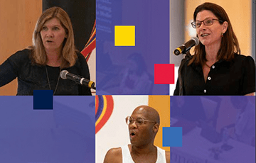 Three people speaking at a symposium