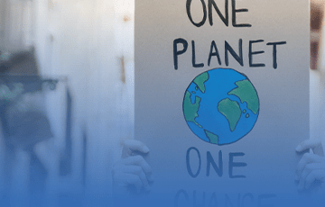 Protest sign that reads &quot;One Planet, One Chance&quot;