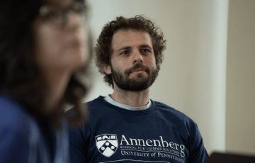 Tom wearing Annenberg T-shirt