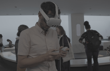 a person uses a VR headset at the opening of "Degrees of Dis/embodiment"