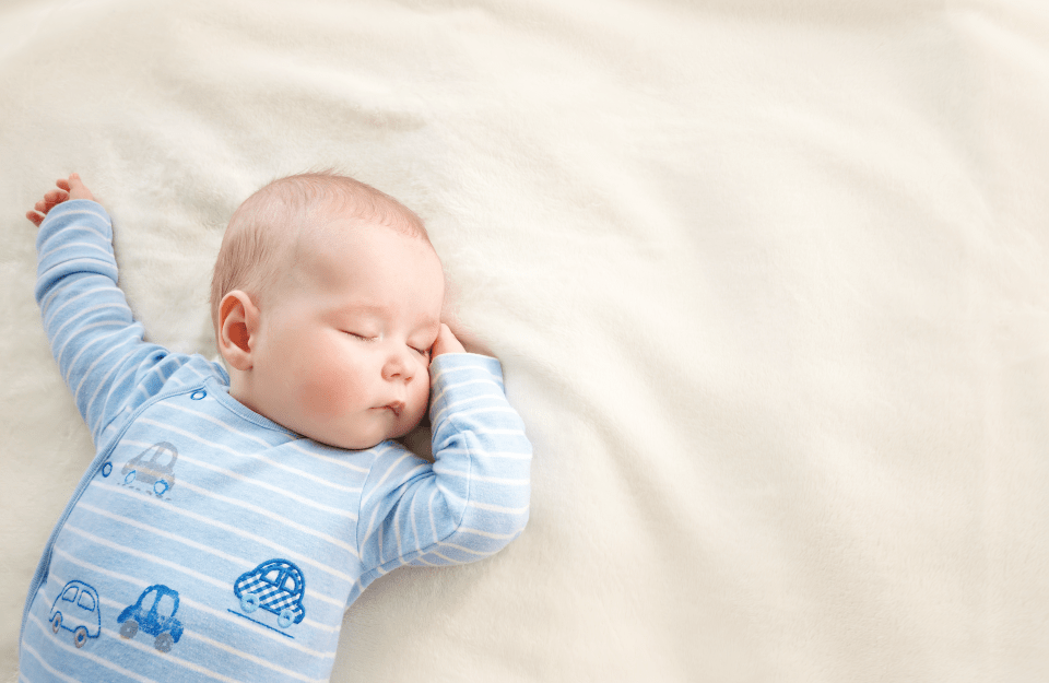 infant sleeping on its back